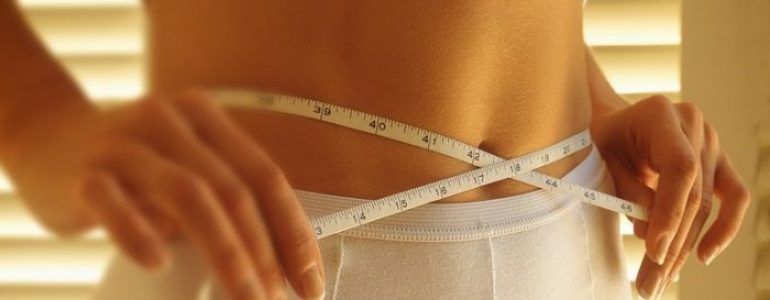 Woman Measuring Waist